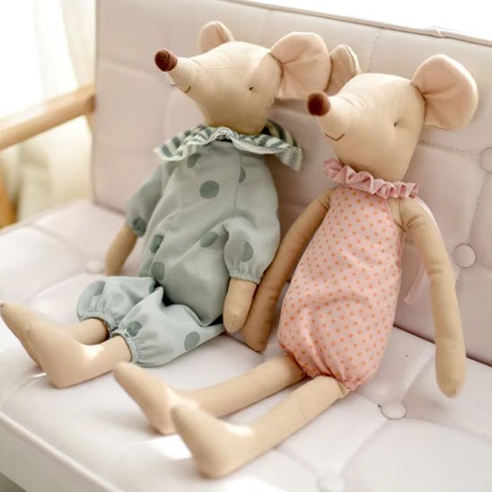 Doudou souri rose bleu assoient