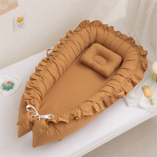 nid bebe reducteur de lit marron