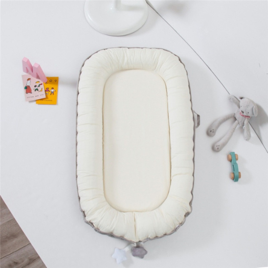reducteur de lit bebe blanc beige