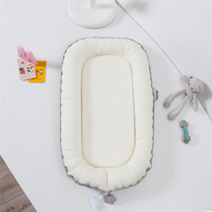 reducteur de lit bebe blanc beige