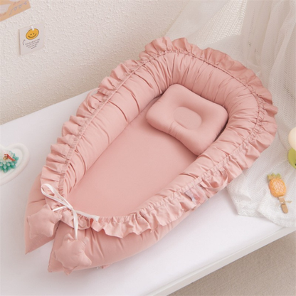 reducteur de lit cocon rose portable